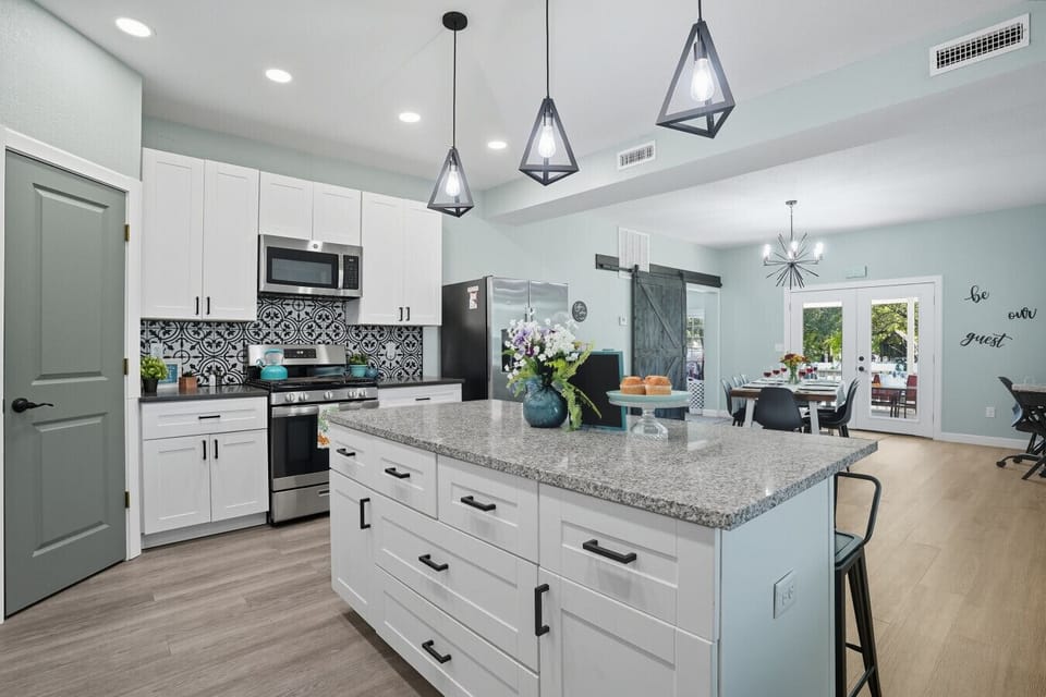 Modern Kitchen | Granite Island with Seating | Sleek Design with Ample Counter Space