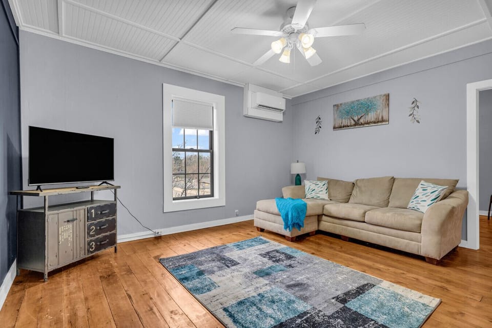 Soft textures, neutral tones, and space to unwind — the kind of living room that just gets you