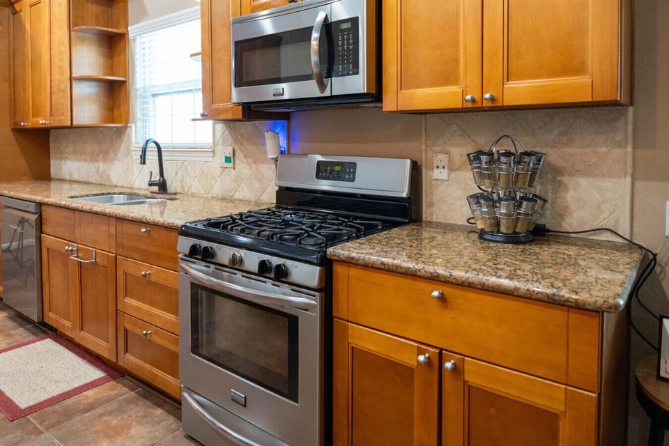 Kitchen | Spacious island with seating, granite counters, and modern stainless steel appliances