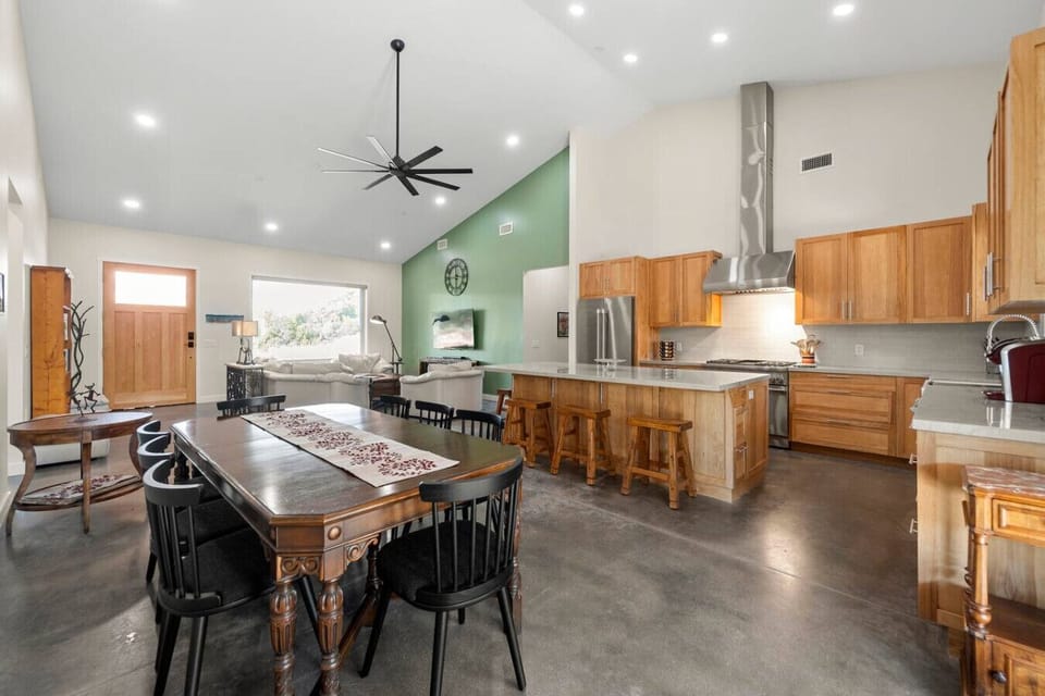 Fully stocked kitchen with dining room table