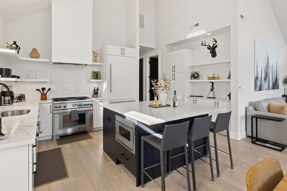 Bright chef’s kitchen with island seating and sleek finishes