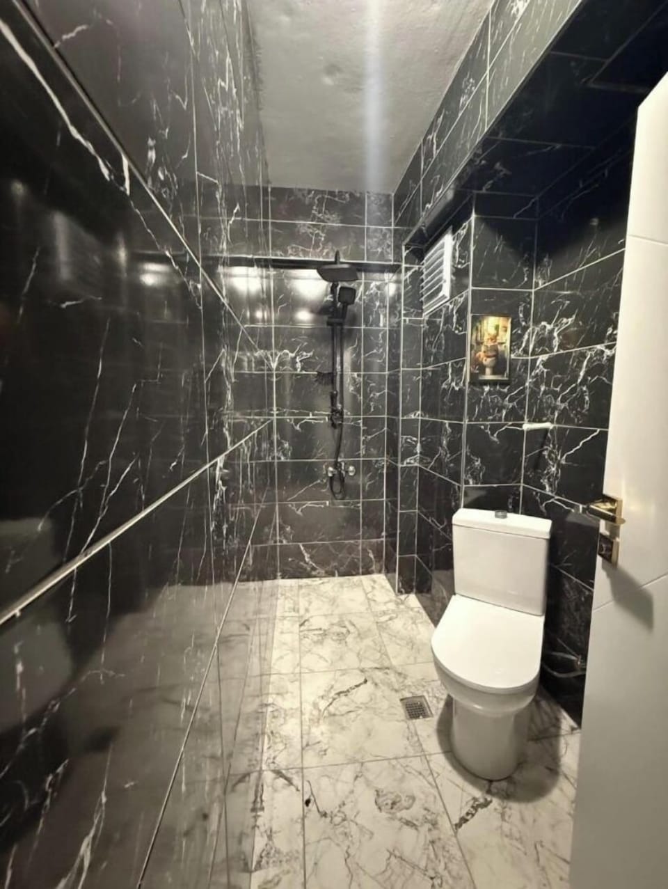 Deluxe Triple Room, City View | Bathroom | Hair dryer, slippers, towels, soap