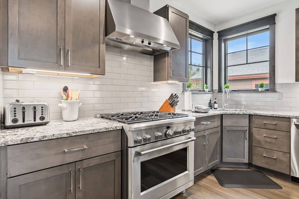 Kitchen: Main floor, drip coffee maker, Keurig, toaster, cooking utensils, tableware