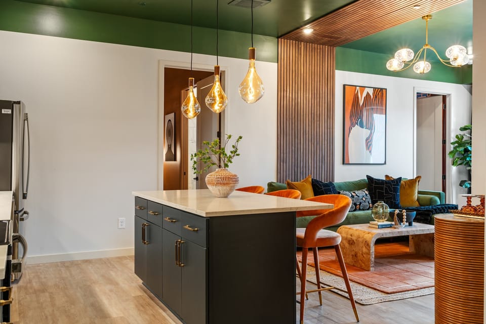 The kitchen island offers additional seating, making it a perfect spot for casual breakfasts or evening snacks.