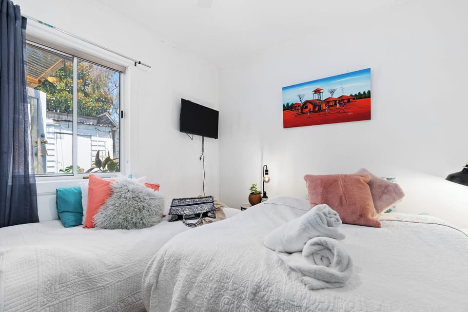 Family Triple Room, Courtyard View | Desk, laptop workspace, blackout drapes, iron/ironing board