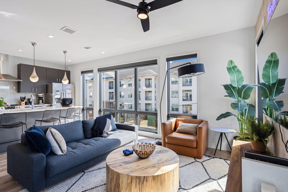 Unwind in the living room with a TV, large windows and a full-size sleeper sofa for additional sleeping arrangements.