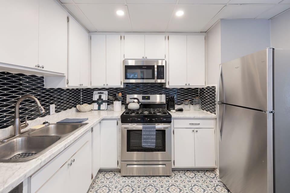 Reliable appliances and ample counter space for meal prepping in the kitchen.