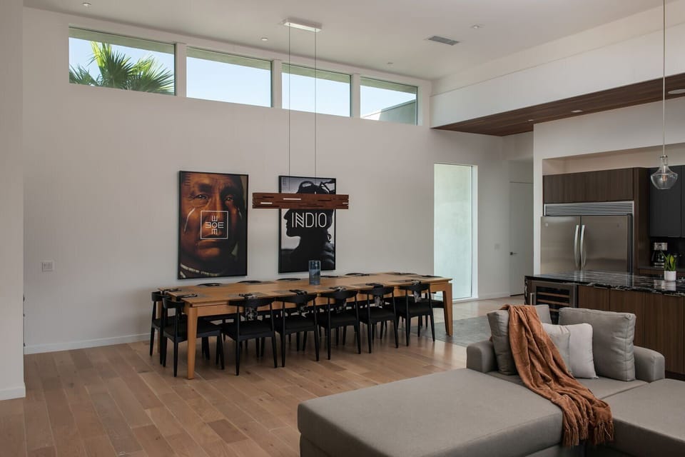 The spacious, naturally lit dining area features a large table that seats 10+, making it ideal for group dinners.