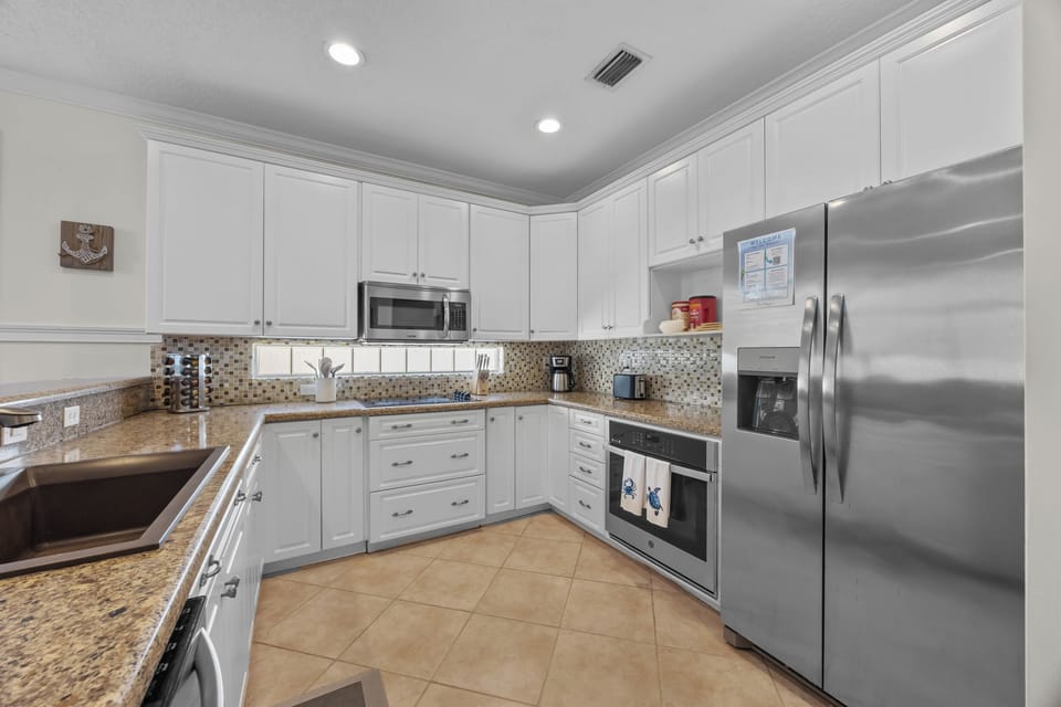 Fully equipped kitchen with modern appliances and ample space