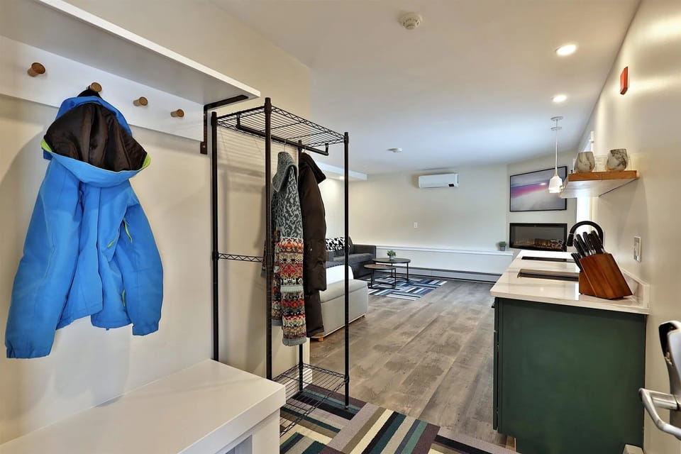 A dedicated entry with a bench and gear rack. Drop your bags, hang your jacket, and settle in.