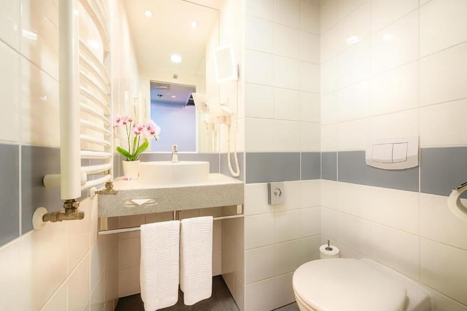 Shower, hair dryer, slippers, towels