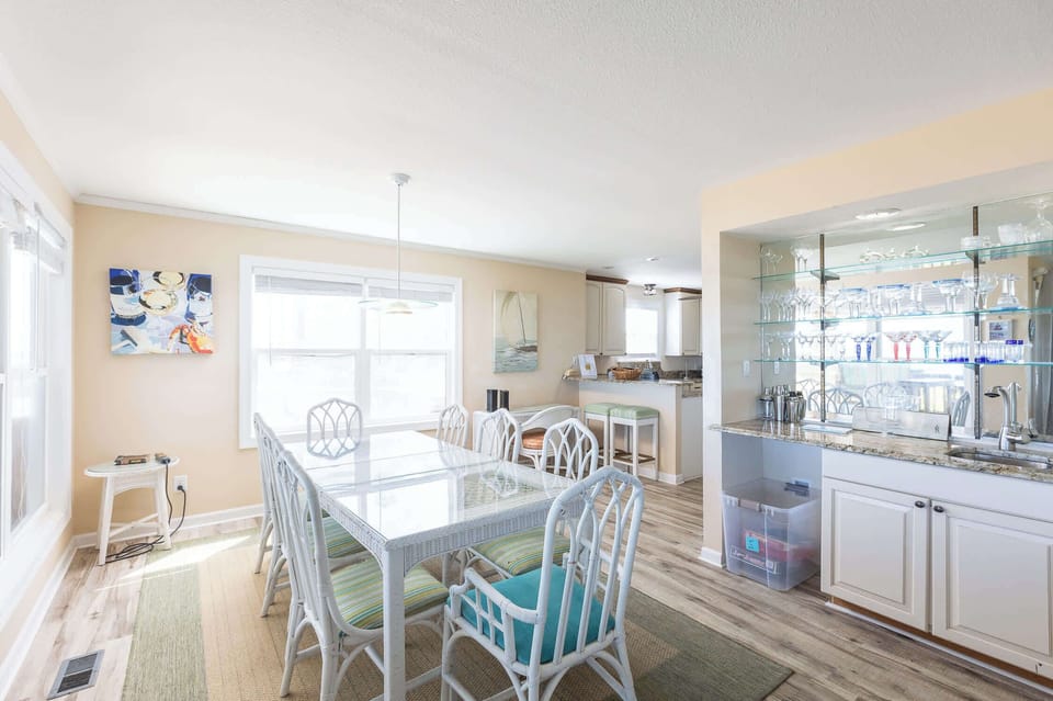 Mid Level: Dining area with seating for 8 featuring expansive views of the ocean