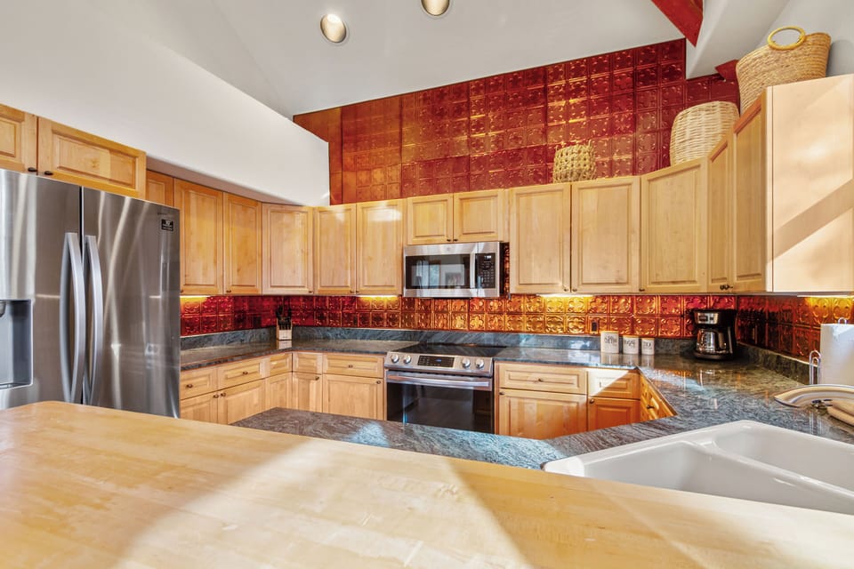 Fully equipped kitchen with space for cooking and entertaining
