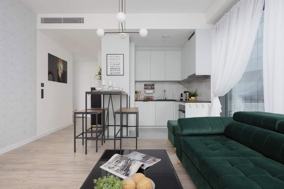 Dining area with natural light – Stylish dining table with designer lighting and modern accents.