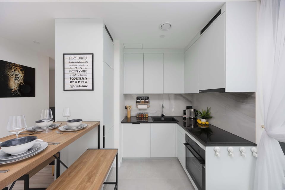 Fully equipped kitchen with breakfast nook – Includes coffee maker, fridge, and all essentials.