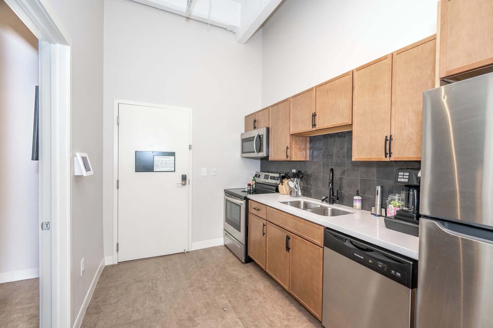 The sleek kitchen offers ample space & all the comforts of home​