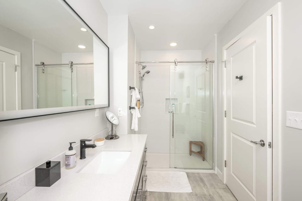 The full bath includes a single vanity & glass shower​