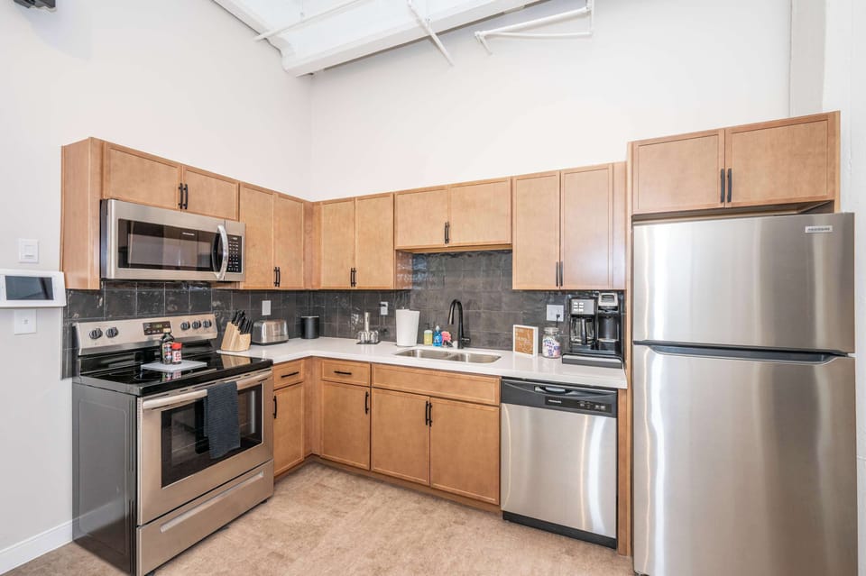 The sleek, open kitchen is well equipped for an unforgettable getaway​