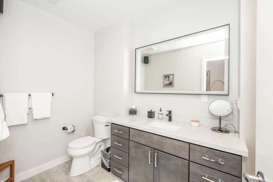 The full bath includes a single vanity & glass shower​