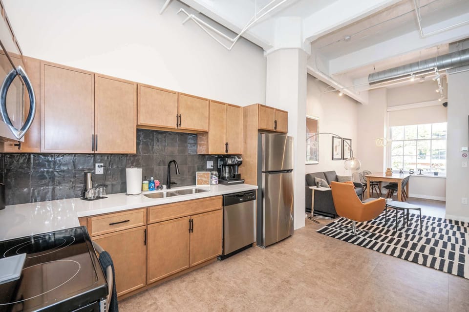 The sleek, open kitchen is well equipped for an unforgettable getaway​