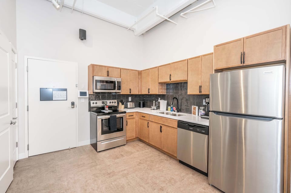 The sleek, open kitchen is well equipped for an unforgettable getaway​
