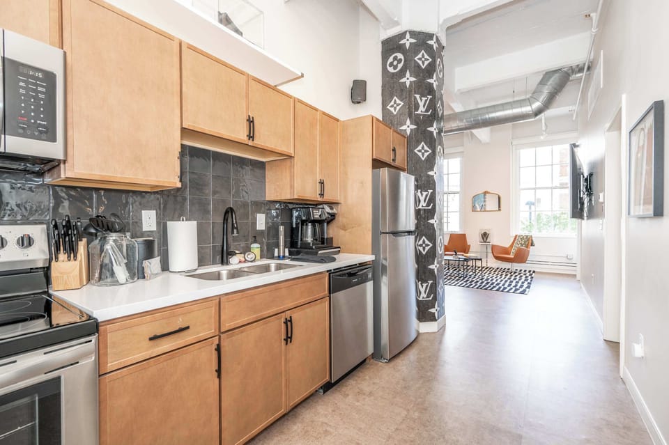 The sleek, open kitchen offers ample storage & every home comfort​