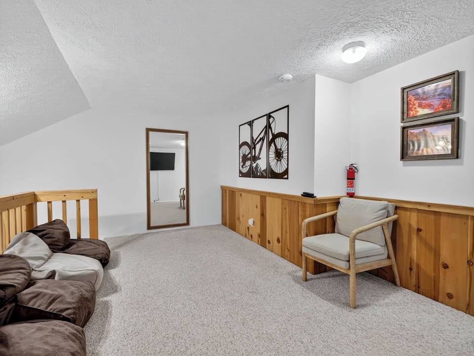 The loft lounge area features a 42” smart TV and cozy bean bags for relaxing and unwinding
