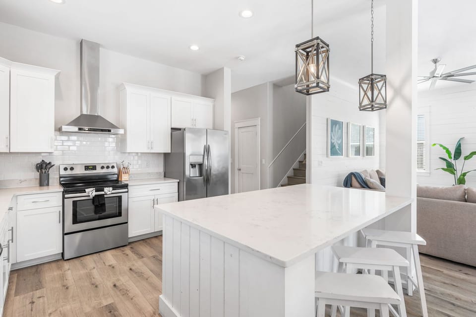 A thoughtfully designed kitchen where polished surfaces and custom finishes come together with effortless style.