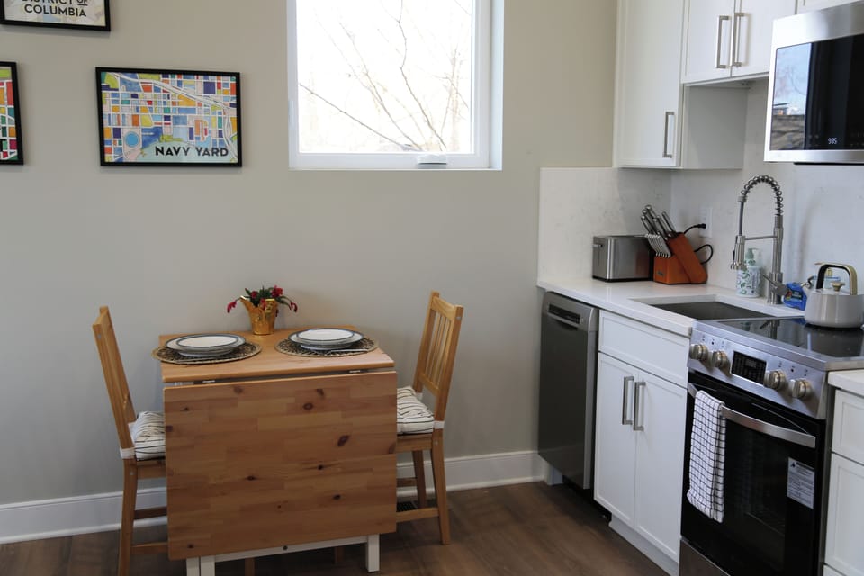 A compact table set for two. The leaf folds out to seat four if needed. 