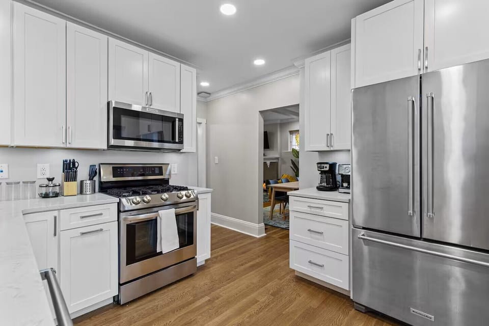 Fully stocked kitchen with appliances, cookware, coffee makers & baking items