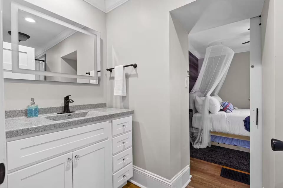 1st floor bedroom with bath access: walk‑in shower, toiletries & towels.