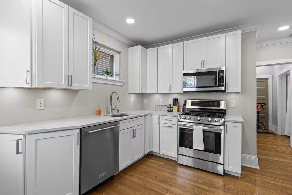 Fully stocked kitchen with appliances, cookware, coffee makers & baking items