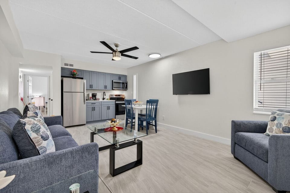 Spacious open-concept living area w/ TV, dining table, and seating perfect for shared downtime.