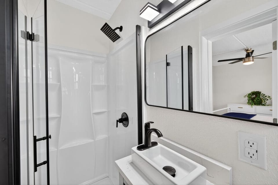 En suite bathroom from another angle, featuring clean finishes and a modern shower
