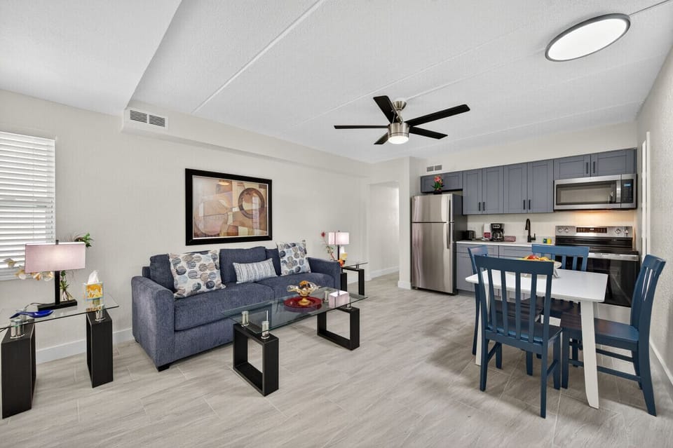 Cozy living space w/ plush couch, neutral tones, and an inviting layout to kick back and relax.
