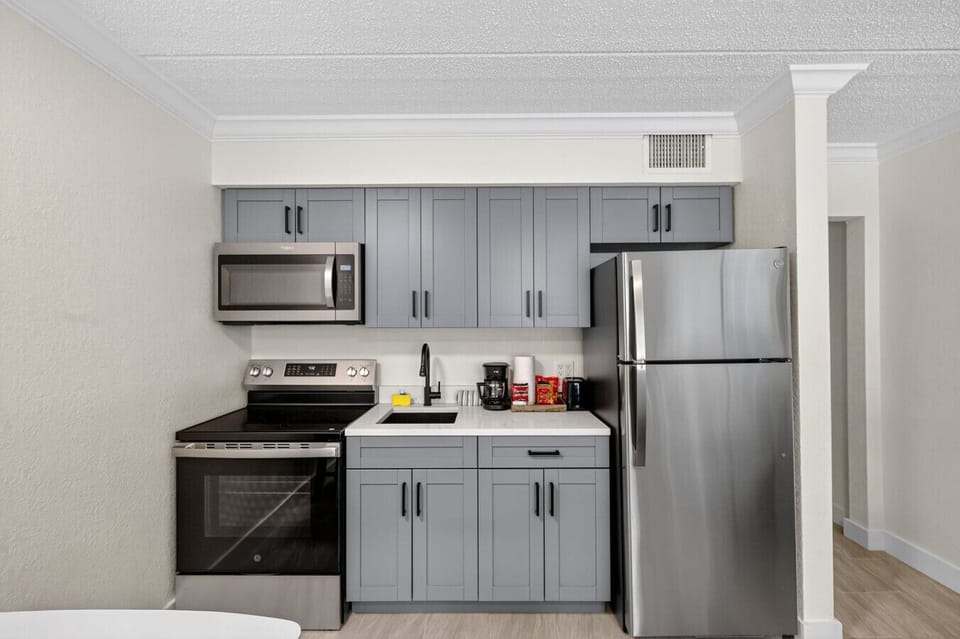Clean, modern kitchen w/ full-size appliances and plenty of room to prep meals.