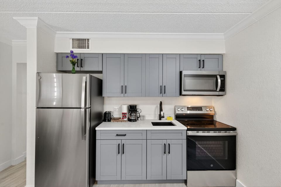 Clean, functional kitchen w/ stainless appliances & ample counter space for easy home cooking.