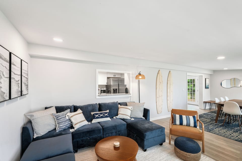 Living area with smart TV and cozy sectional sofa.