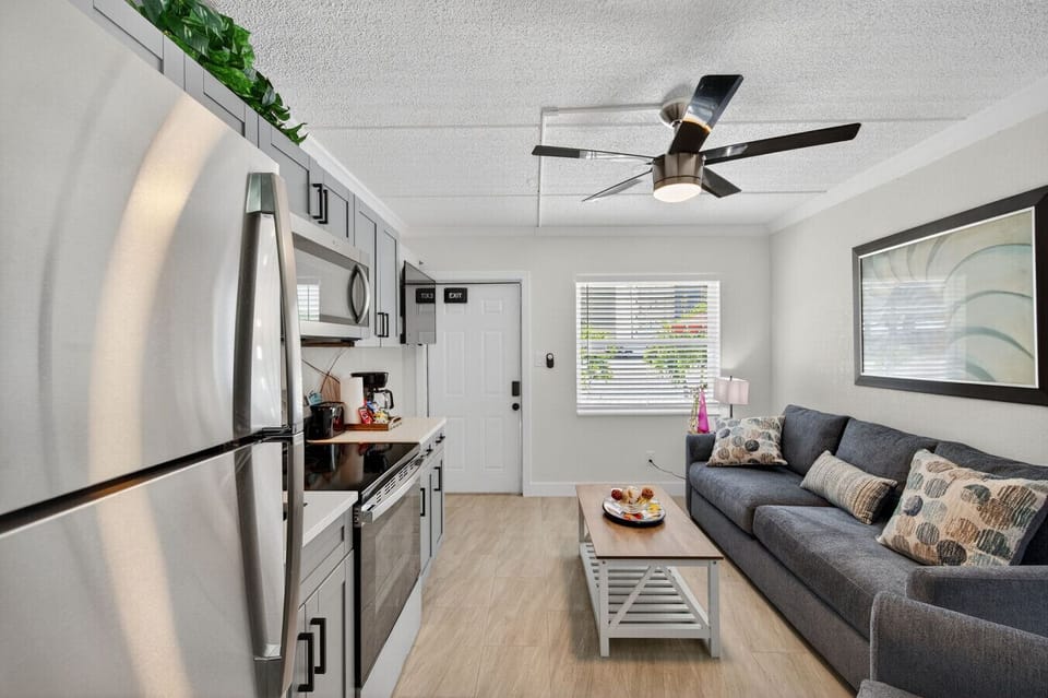 Open living area w/ stylish seating & easy flow into the kitchen