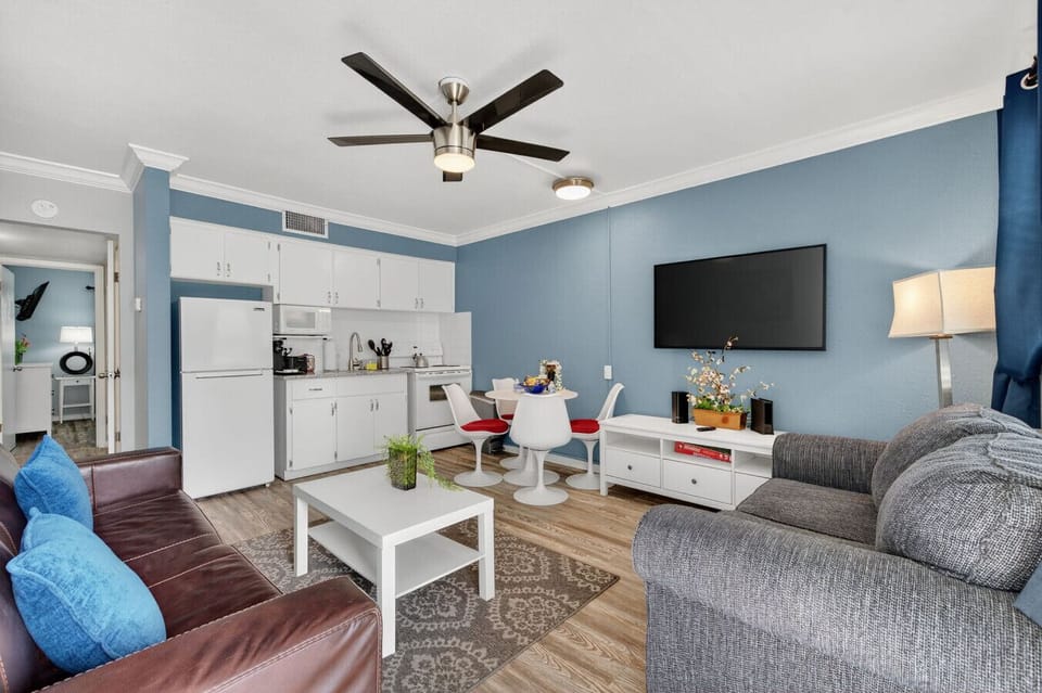 Open-concept living space connecting kitchen, dining & lounge areas for easy flow.