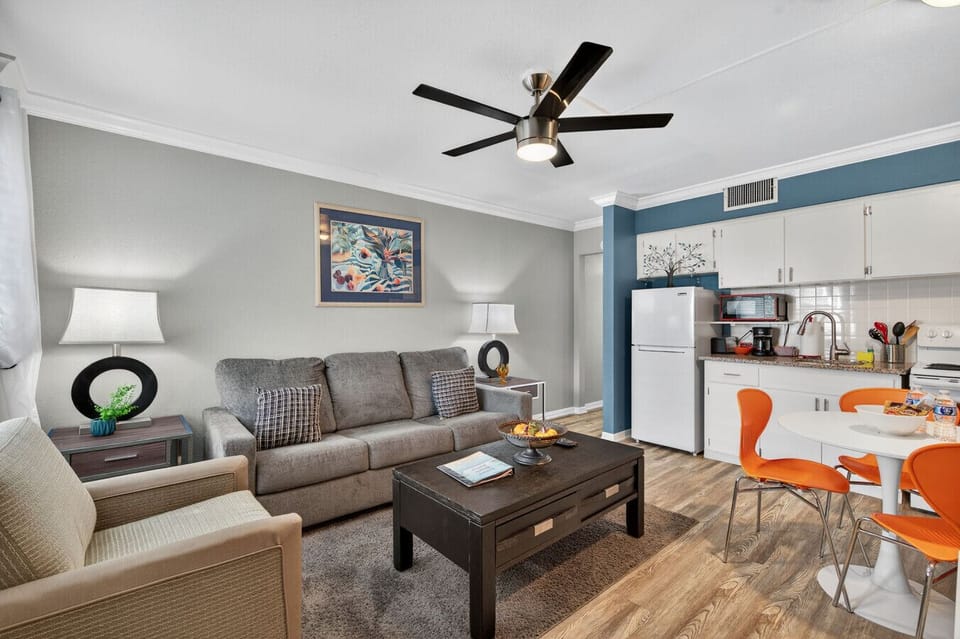 Inviting living room w/ plush seating & warm accents for movie nights or downtime.