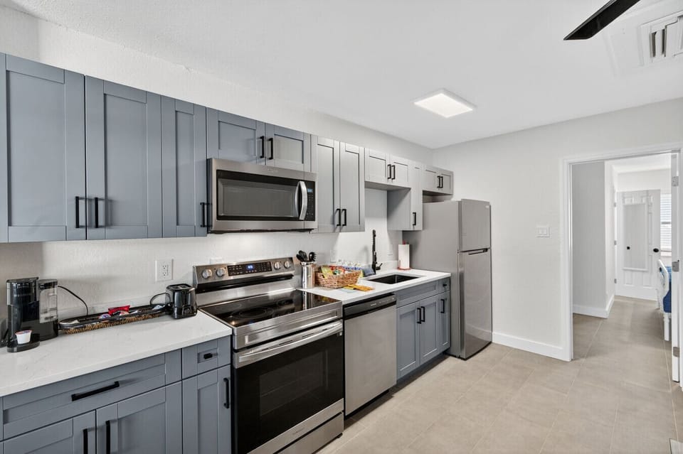 Modern kitchen w/ stainless steel appliances & plenty of prep space