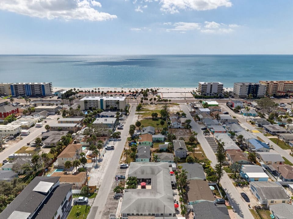 Wide aerial perspective highlighting the coastal setting near the Gulf