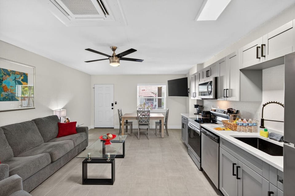 Spacious open-concept layout connecting the living room & kitchen