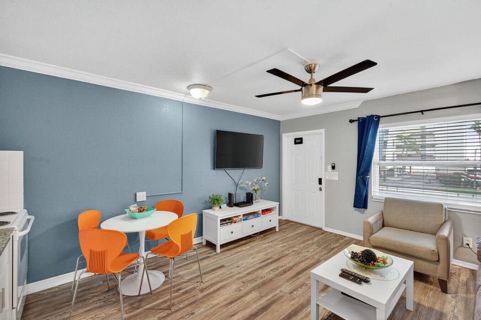 Open living space w/ a dining nook, colorful chairs, and plenty of room to unwind.