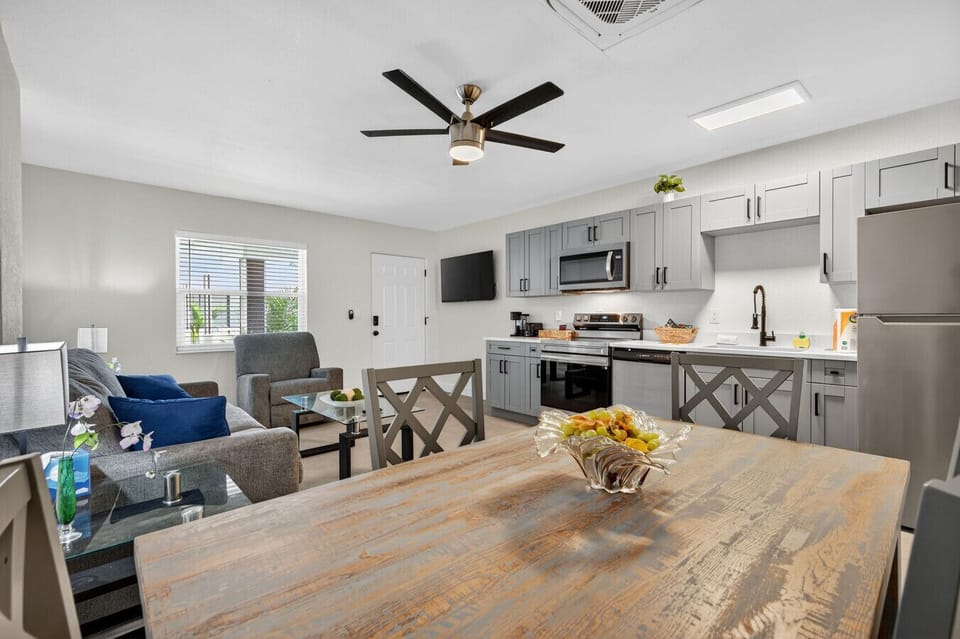 Open-concept living, dining, & kitchen space designed for easy flow & connection