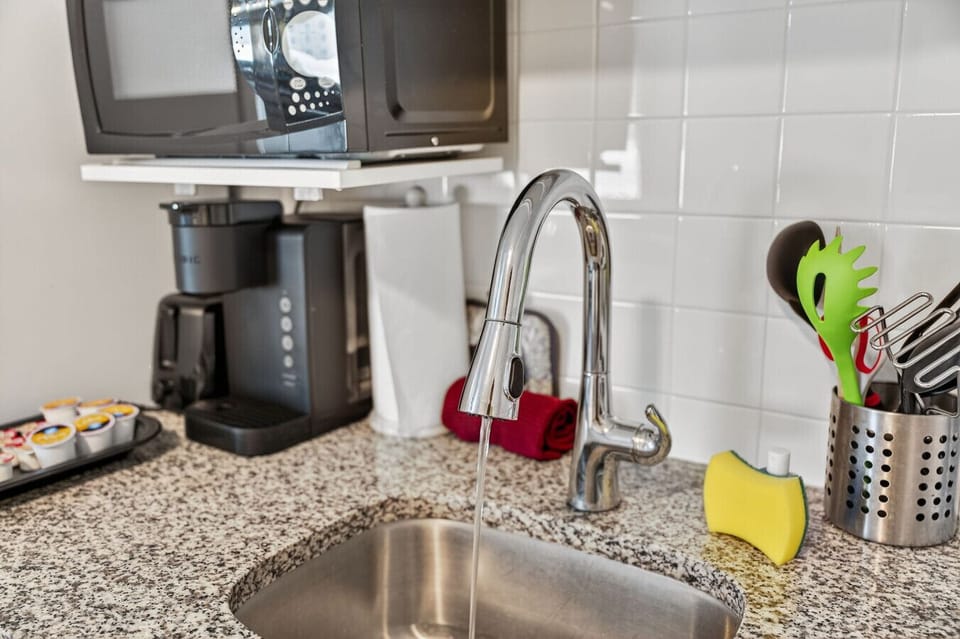Convenient coffee station w/ counter space to start your mornings with ease.