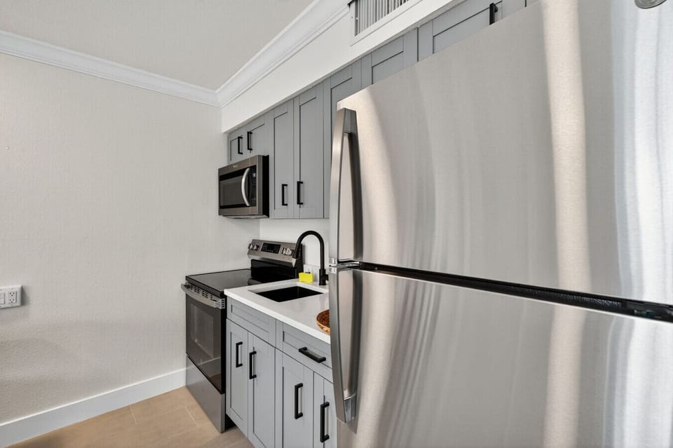 Well-equipped kitchen w/ full-size fridge, microwave & ample storage for longer stays.