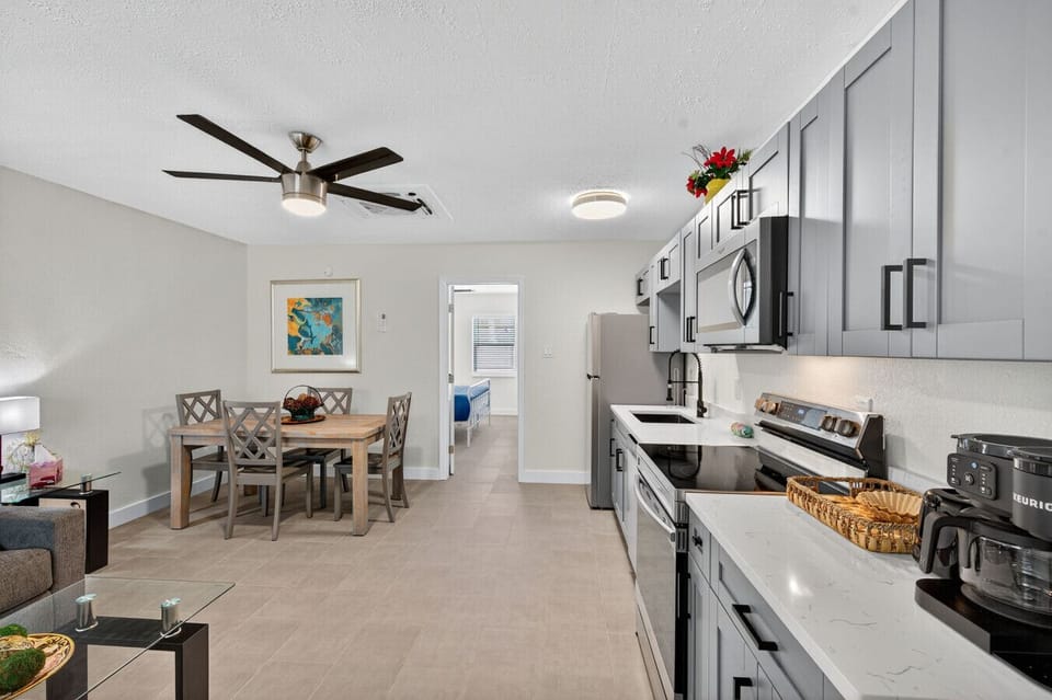 Open dining & kitchen area designed for gathering, meals, and casual conversation.