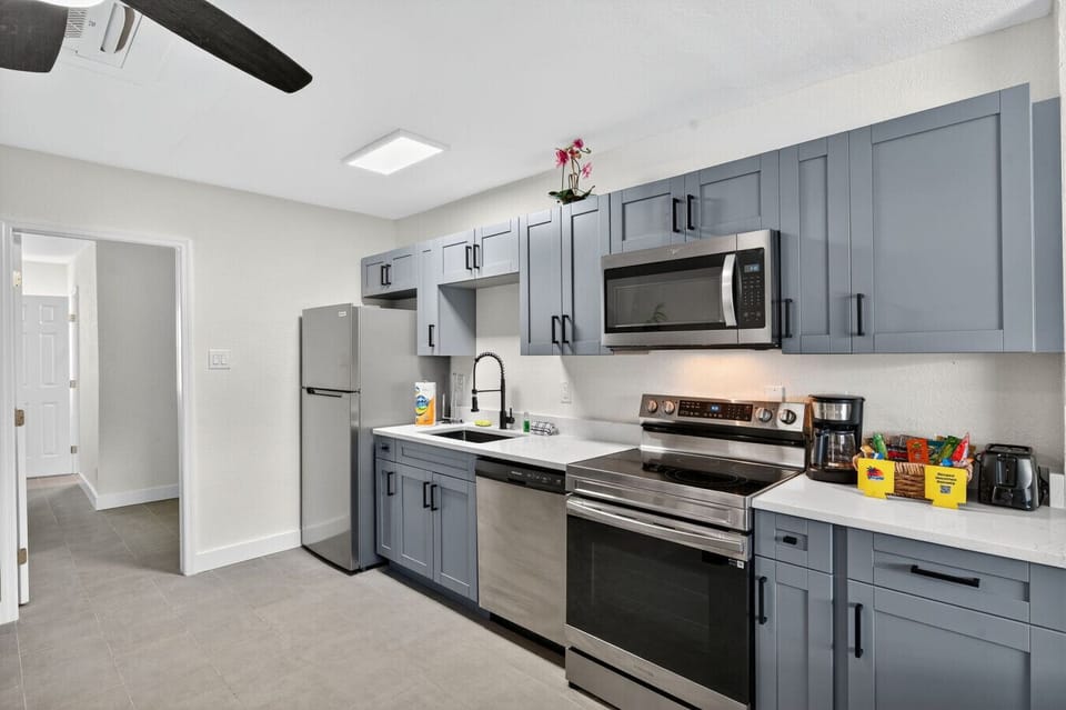 Fully equipped kitchen w/ modern appliances & ample counter space for easy cooking.